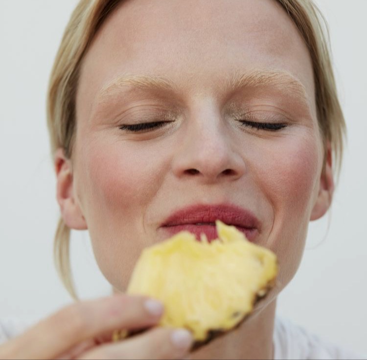 Woman Eating Fruit